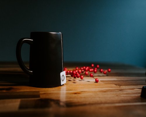 Deep ruby red hibiscus tea in a ceramic mug
